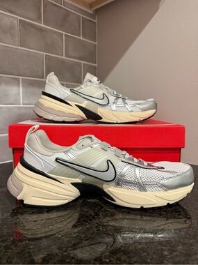 Size 11 Women’s or 9.5 Men’s Nike Silver and Cream Mesh Running Sneakers